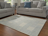 Bay Furniture Gallery - Ashley Furniture - Dylanton Rug - 5' x 7' Area Rug / Ivory/Blue - R407812